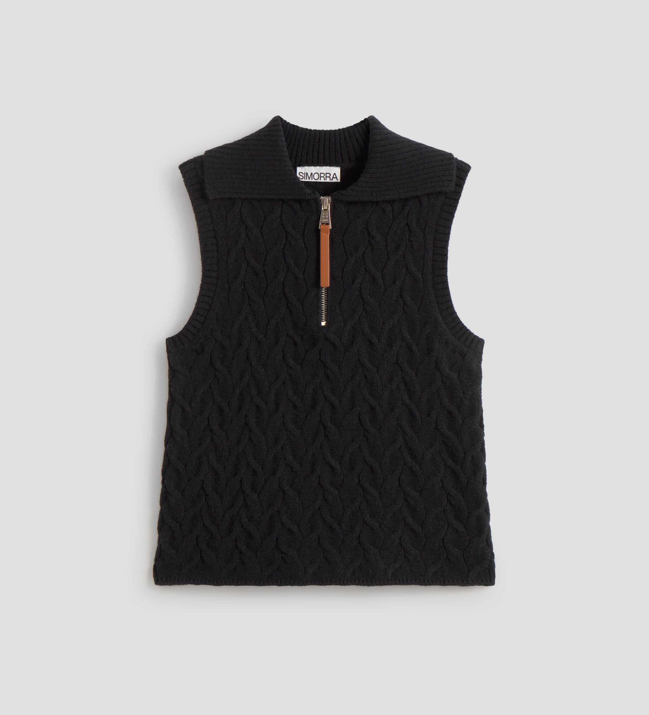 Knitted vest with braids