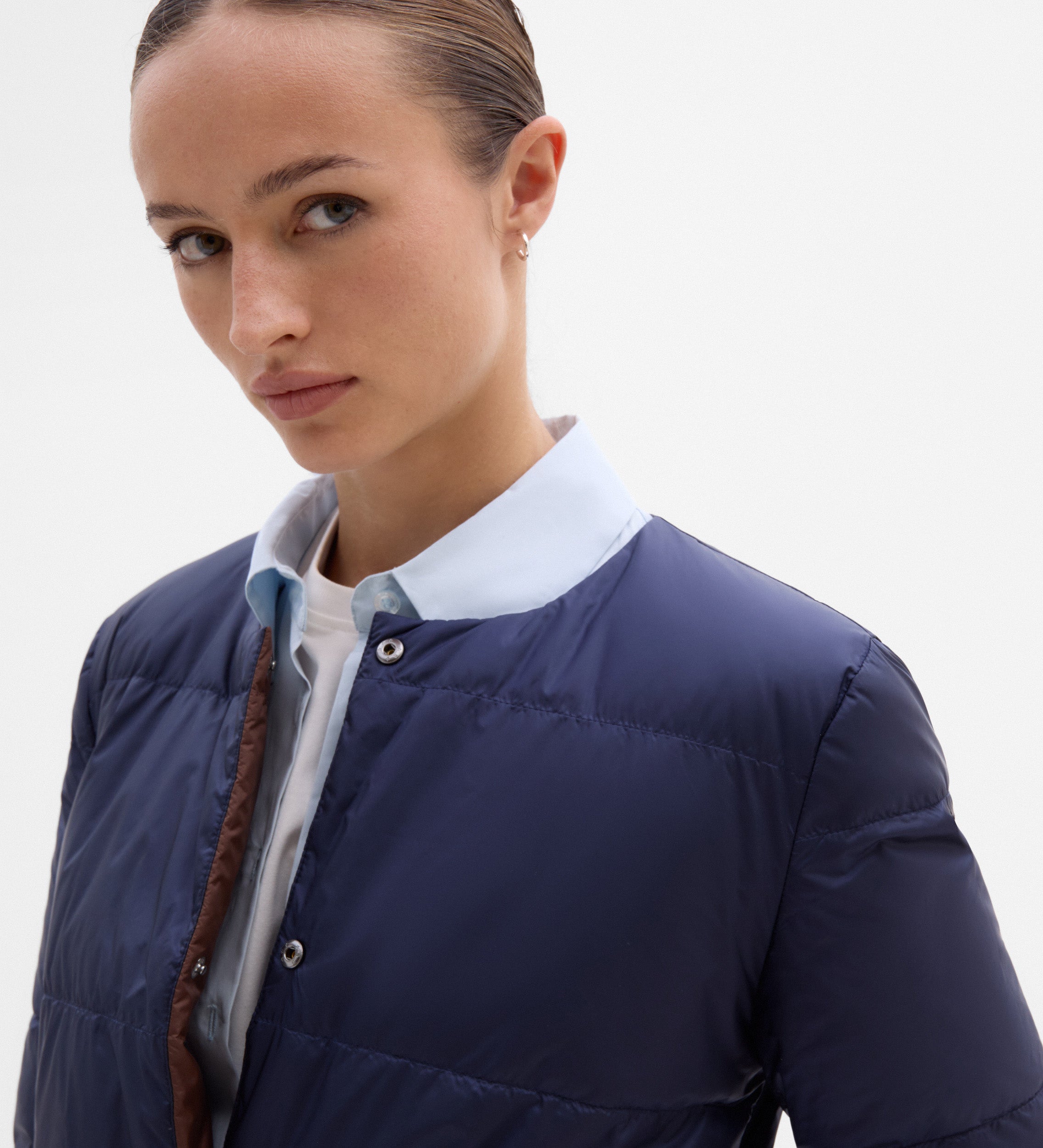 Plumífero reversible cinturón