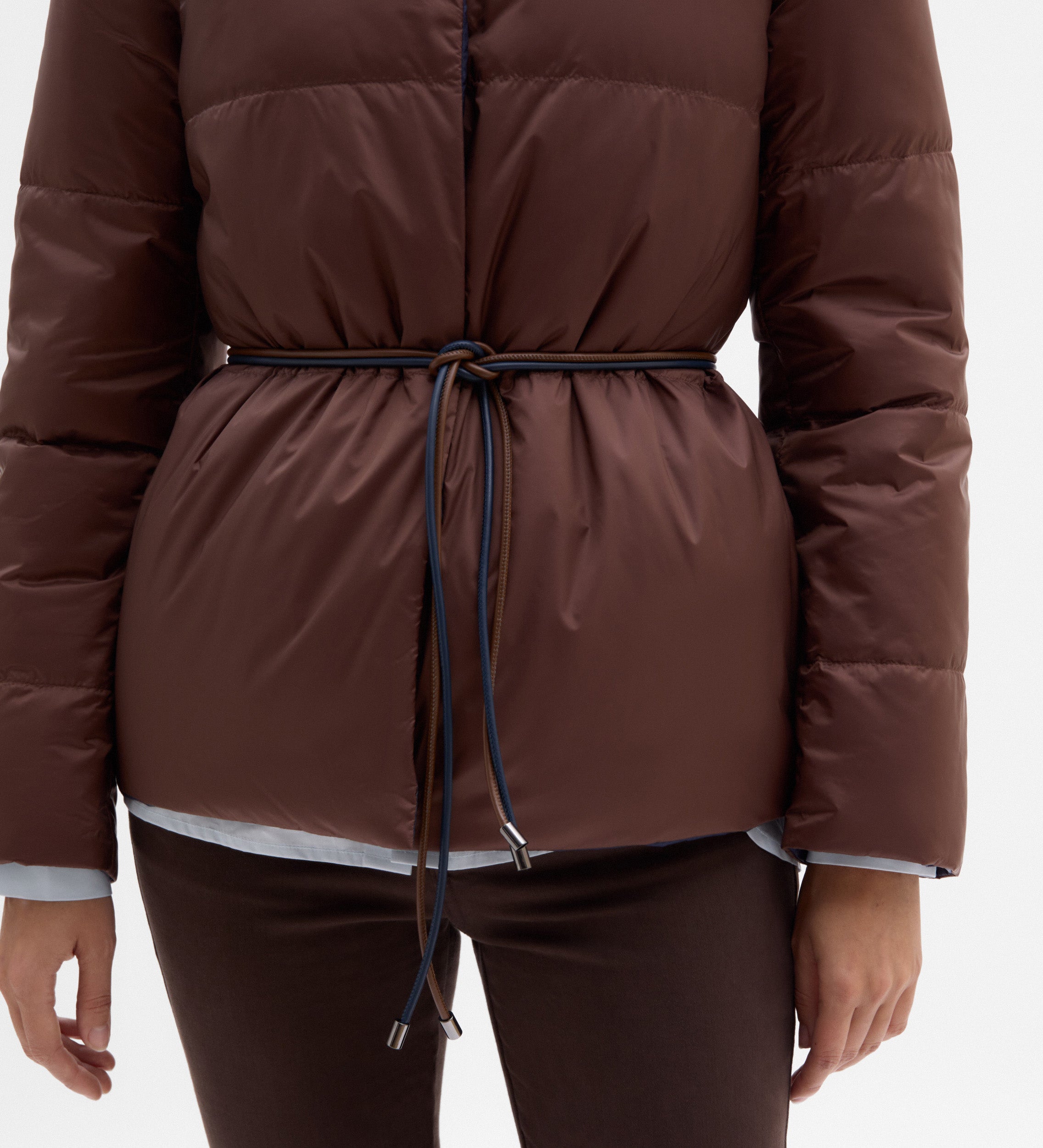 Plumífero reversible cinturón