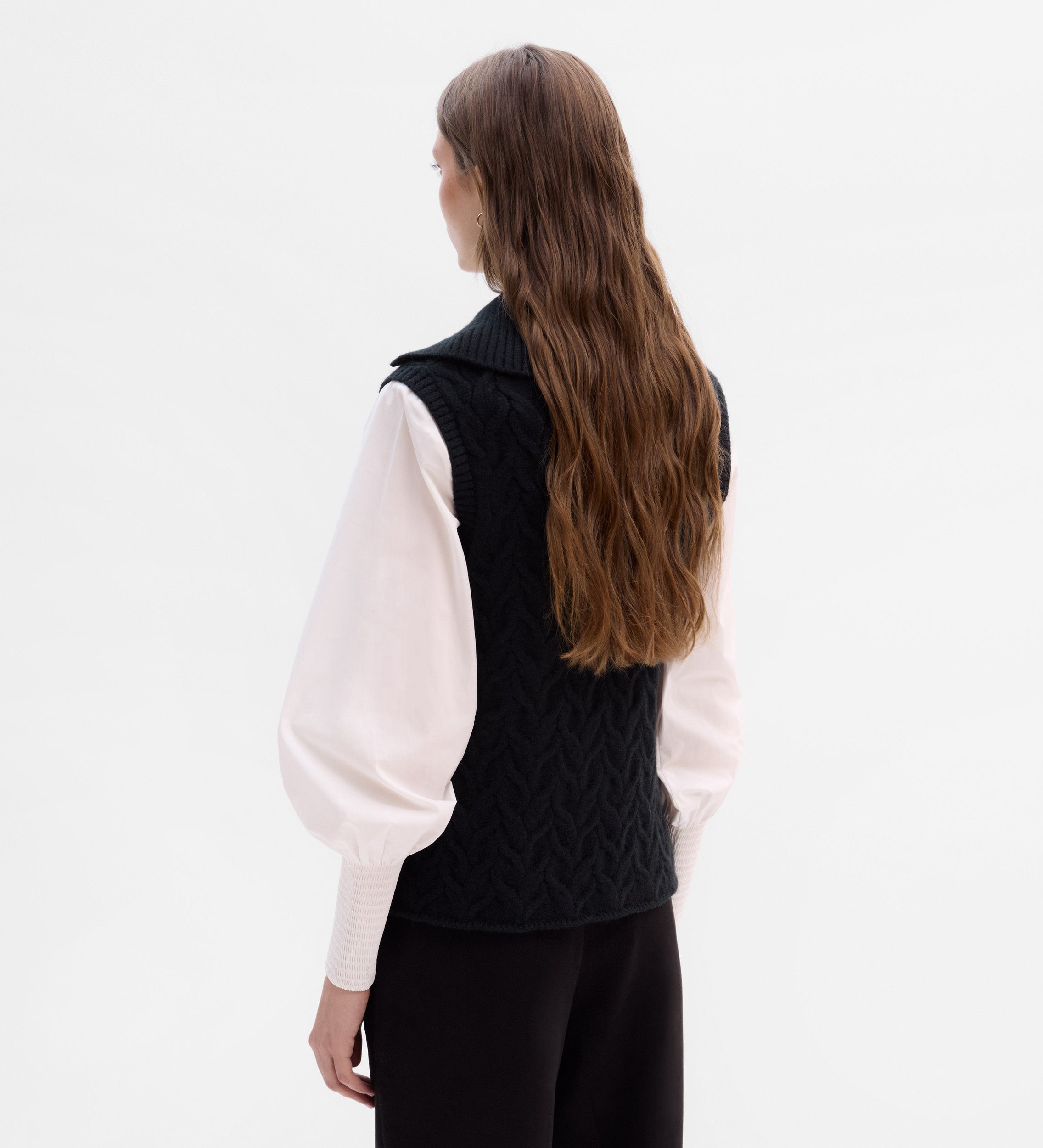 Knitted vest with braids