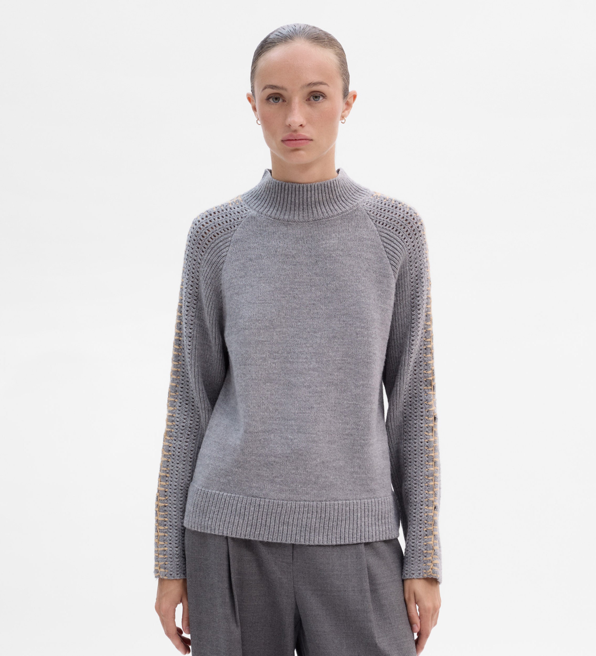 Knit sweater with contrast stitching