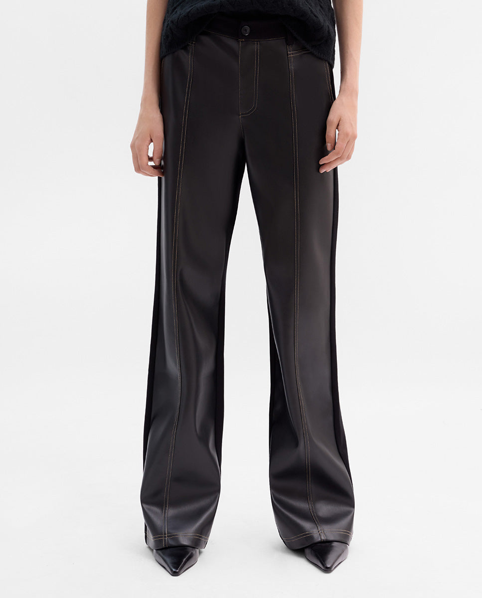 Bi-material trousers with stitching