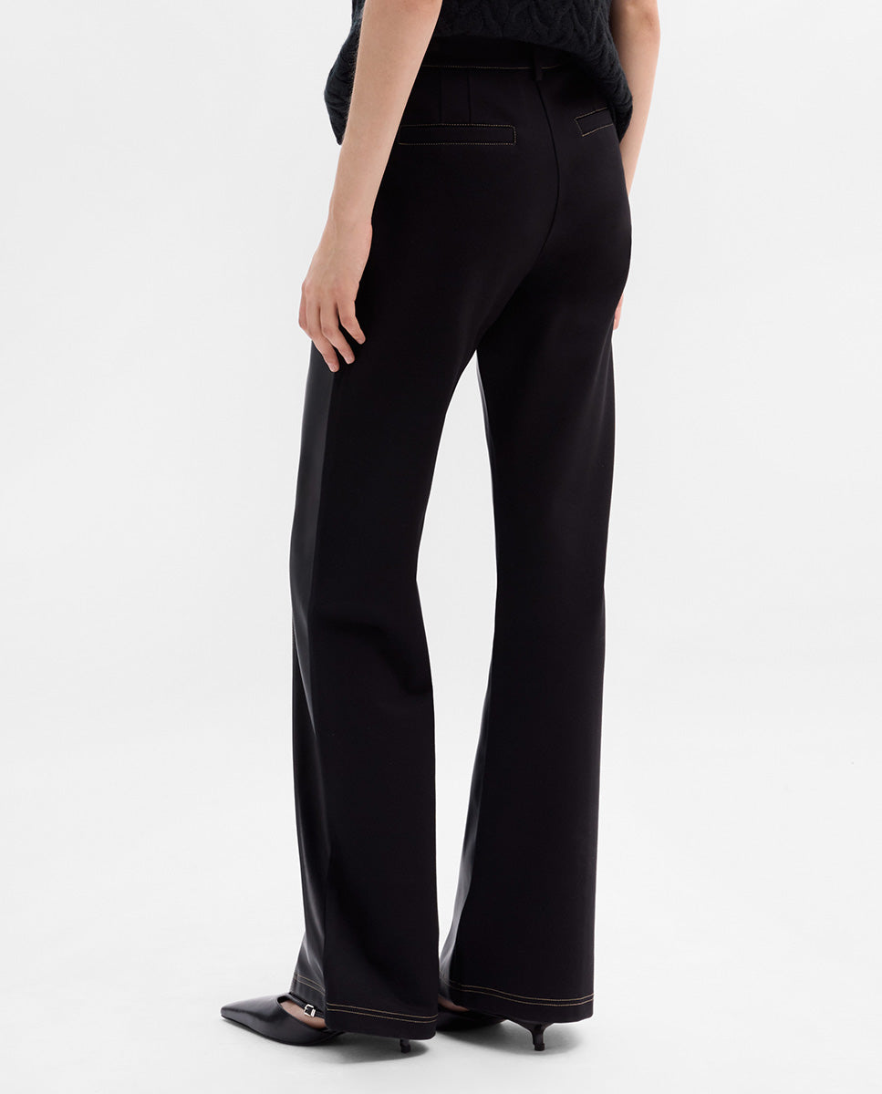 Bi-material trousers with stitching