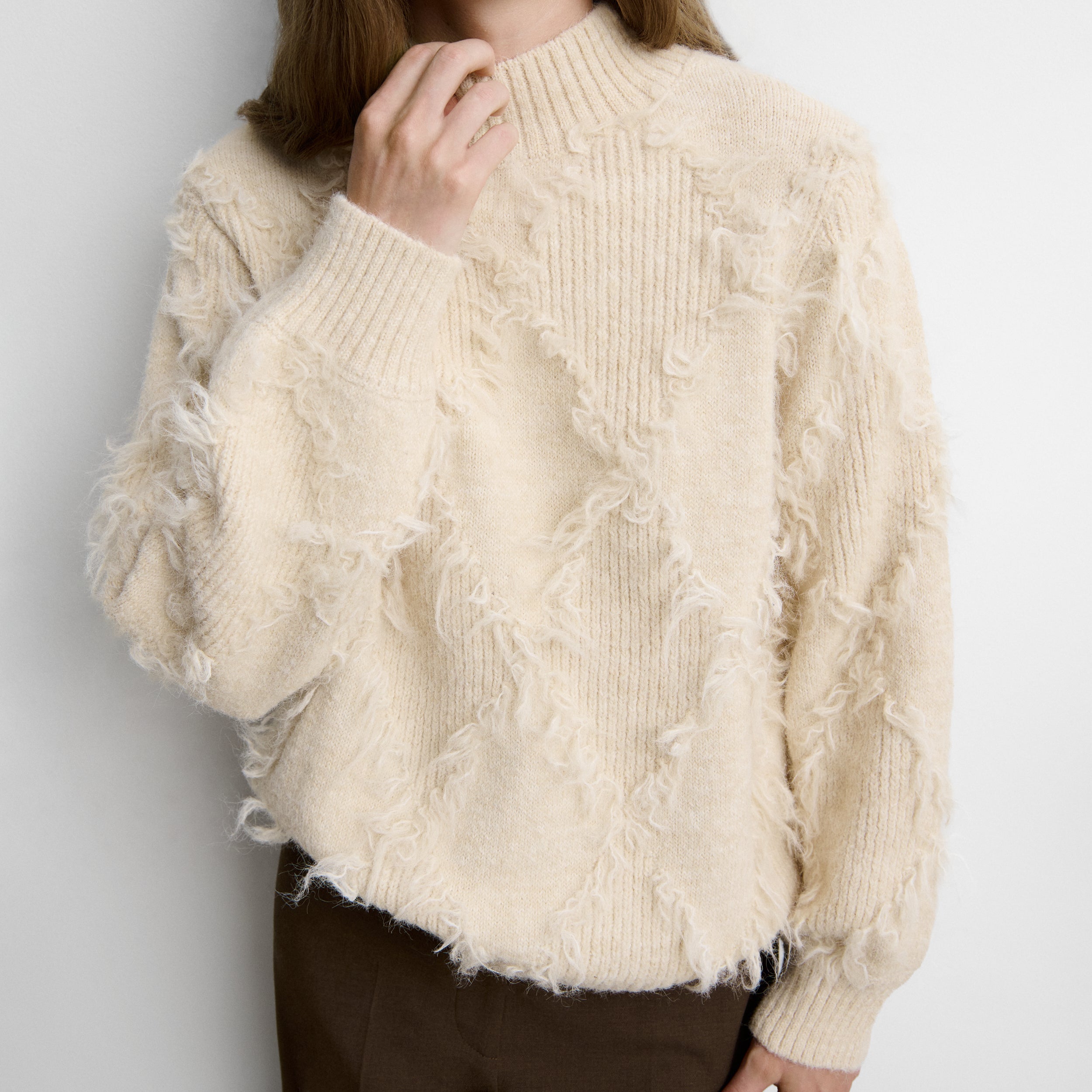 Fringed diamond-pattern sweater
