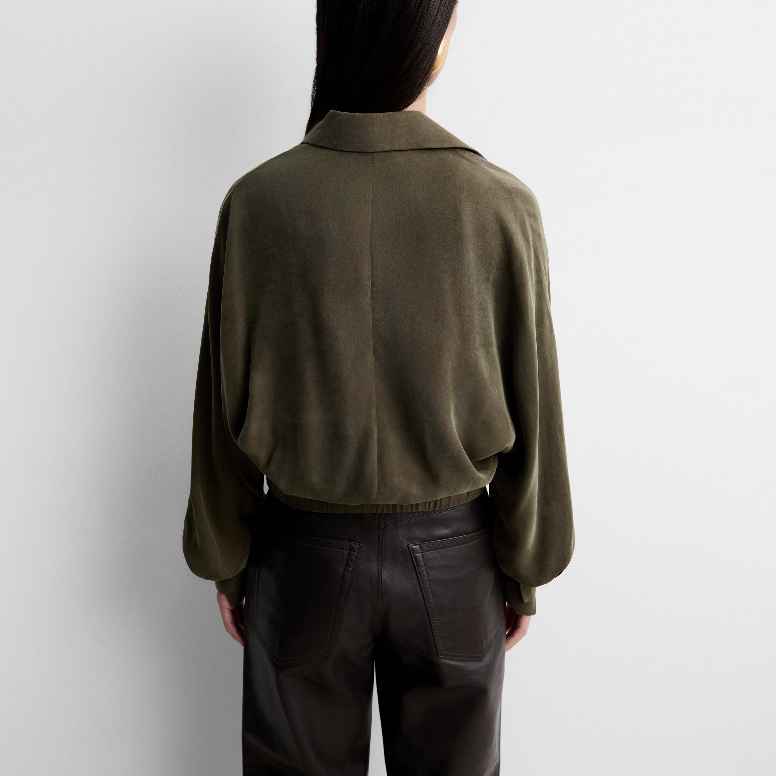 Fluid blouse with wrap neckline
