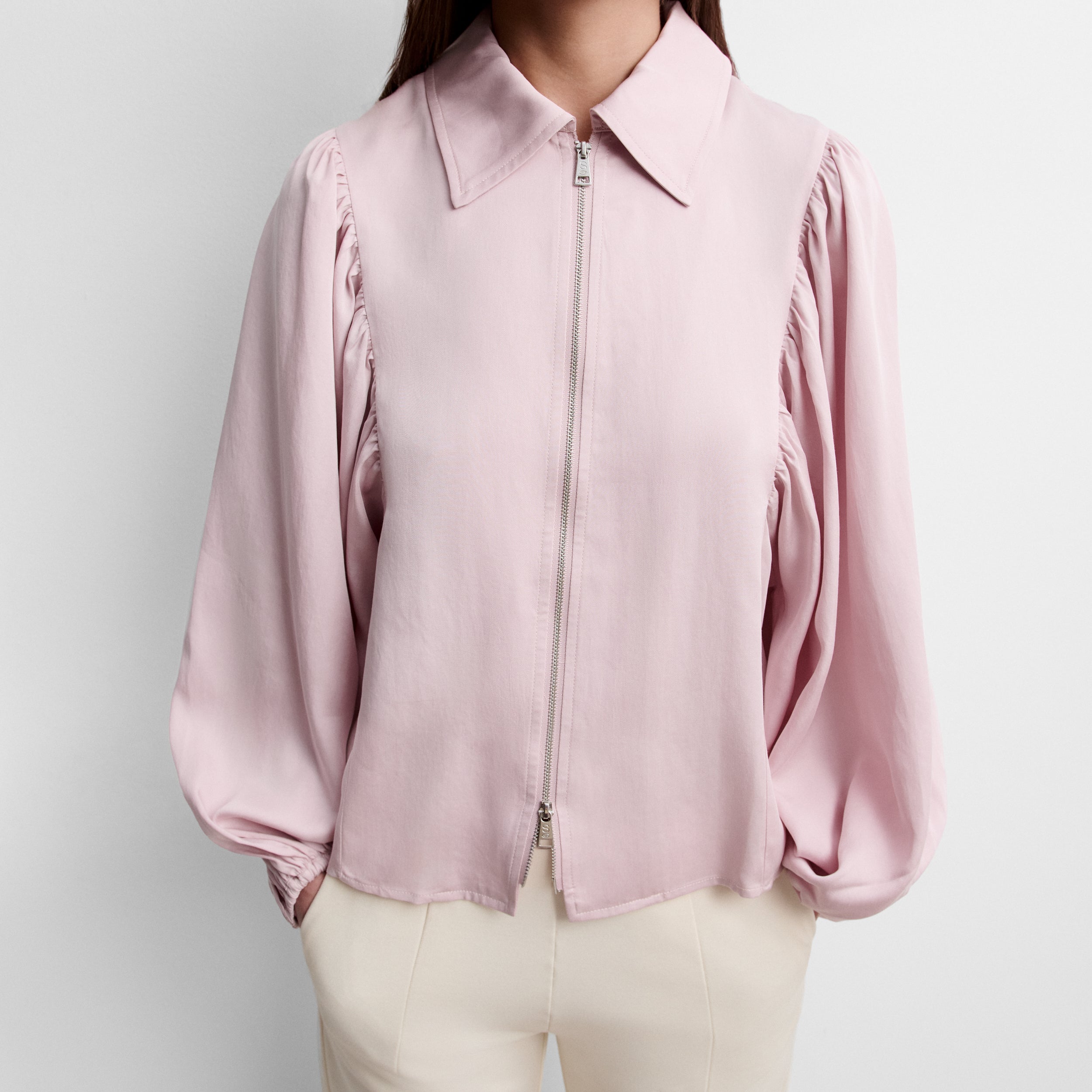 Blouse à fermeture éclair et manches bouffantes