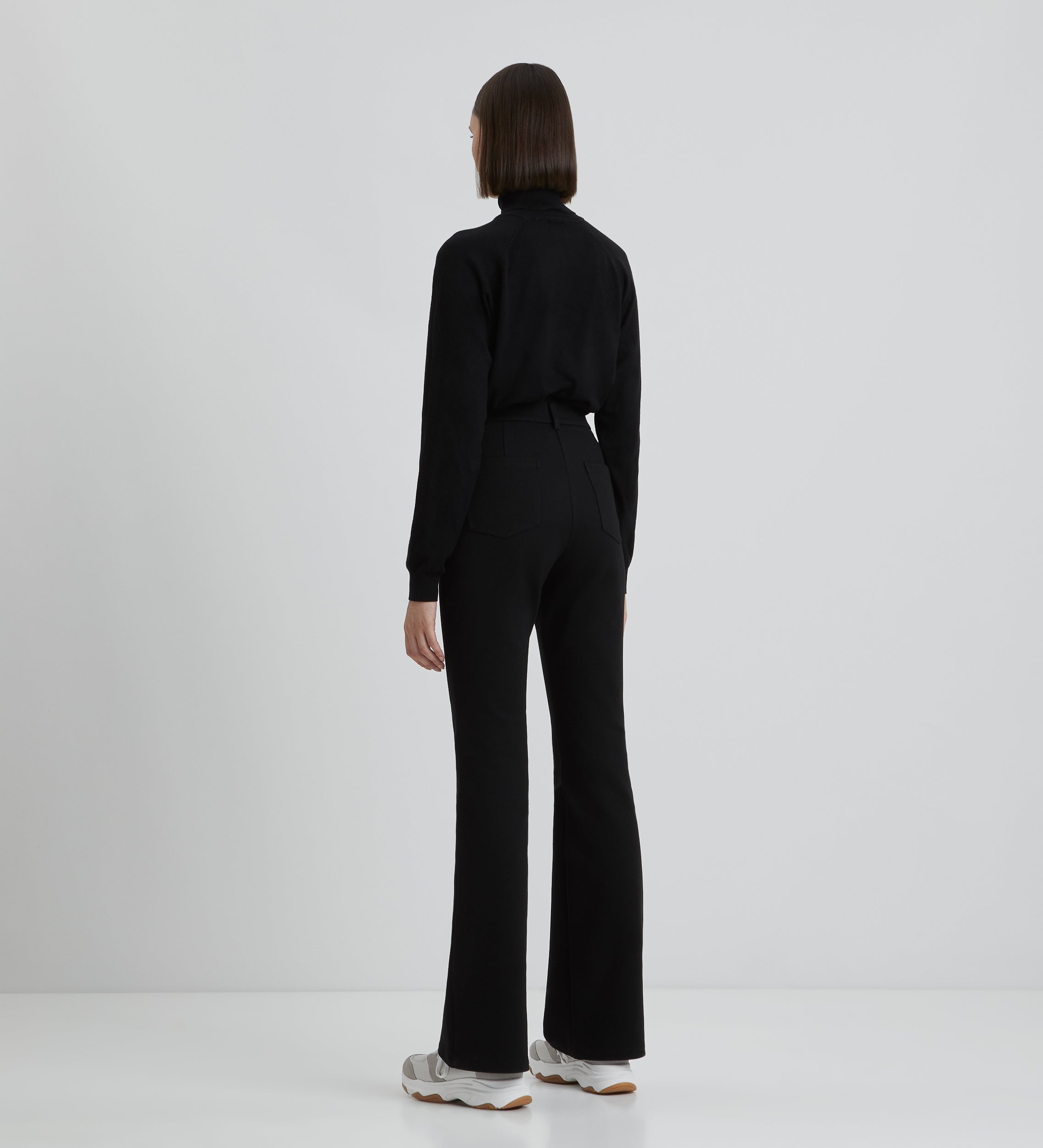Flared elastic trousers