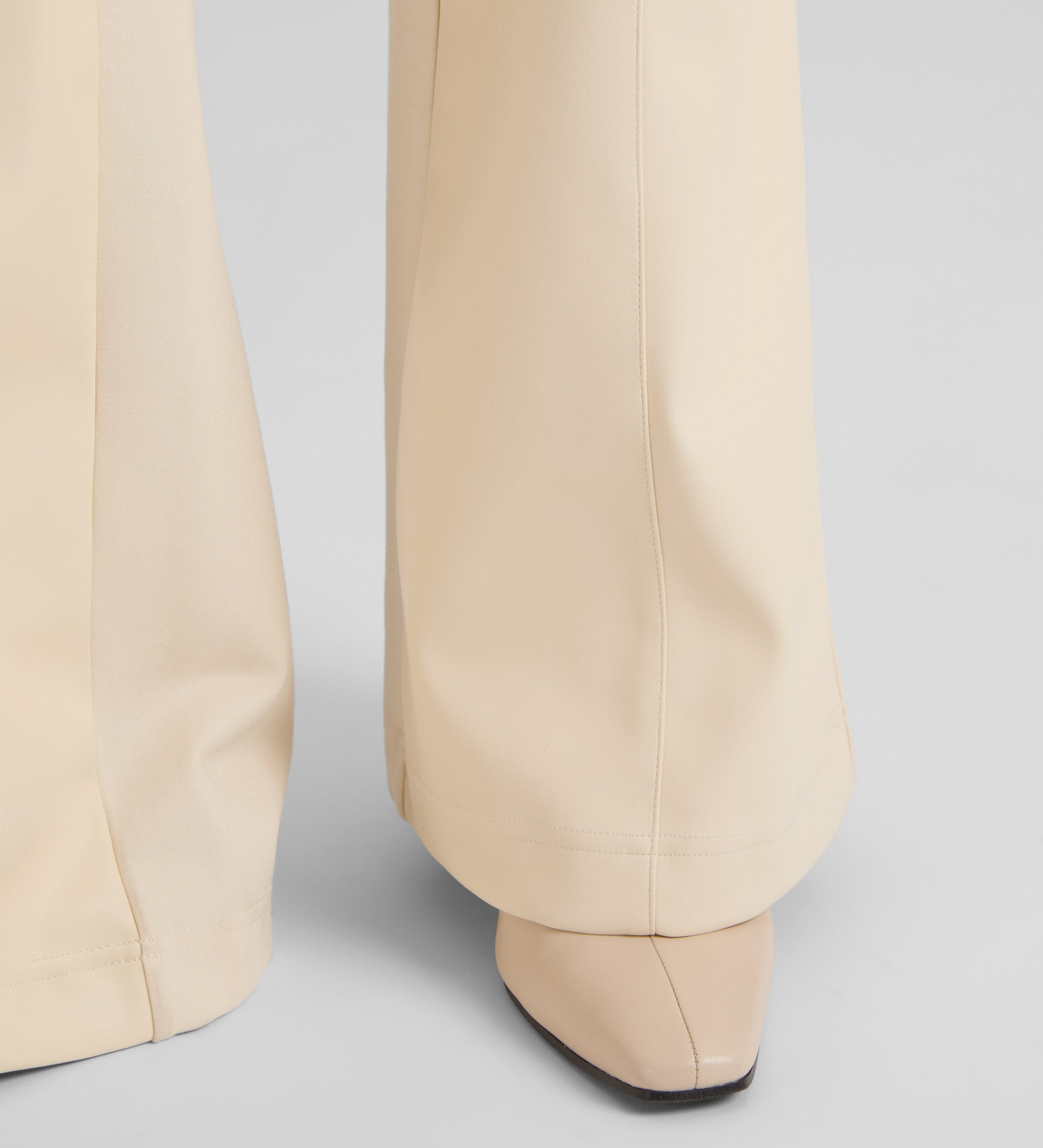 Bell-bottom bi-material trousers