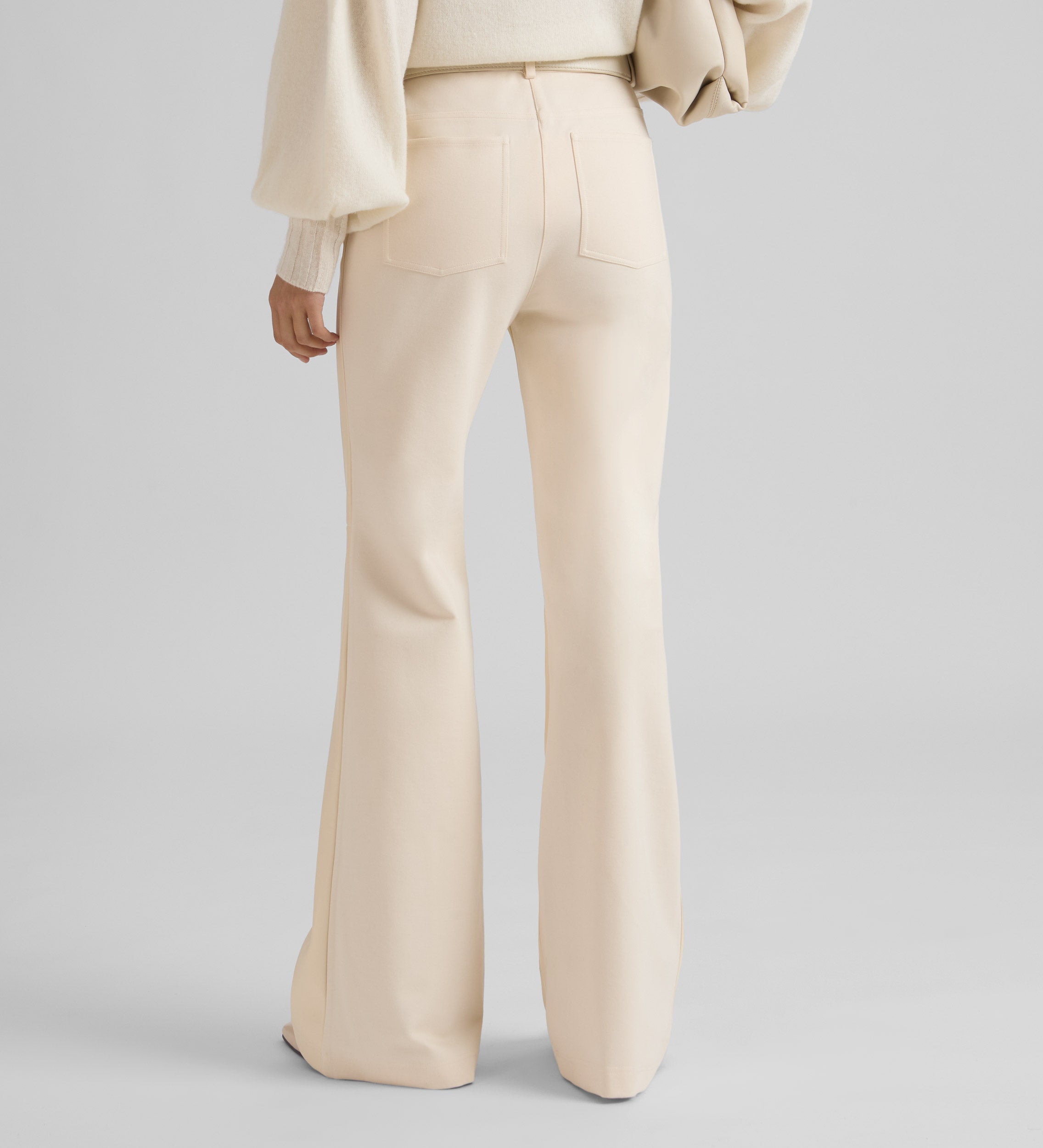 Bell-bottom bi-material trousers