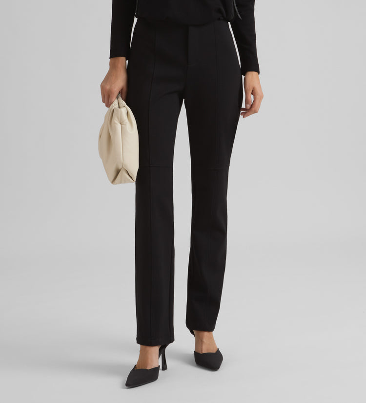 Straight elastic trousers with cuts