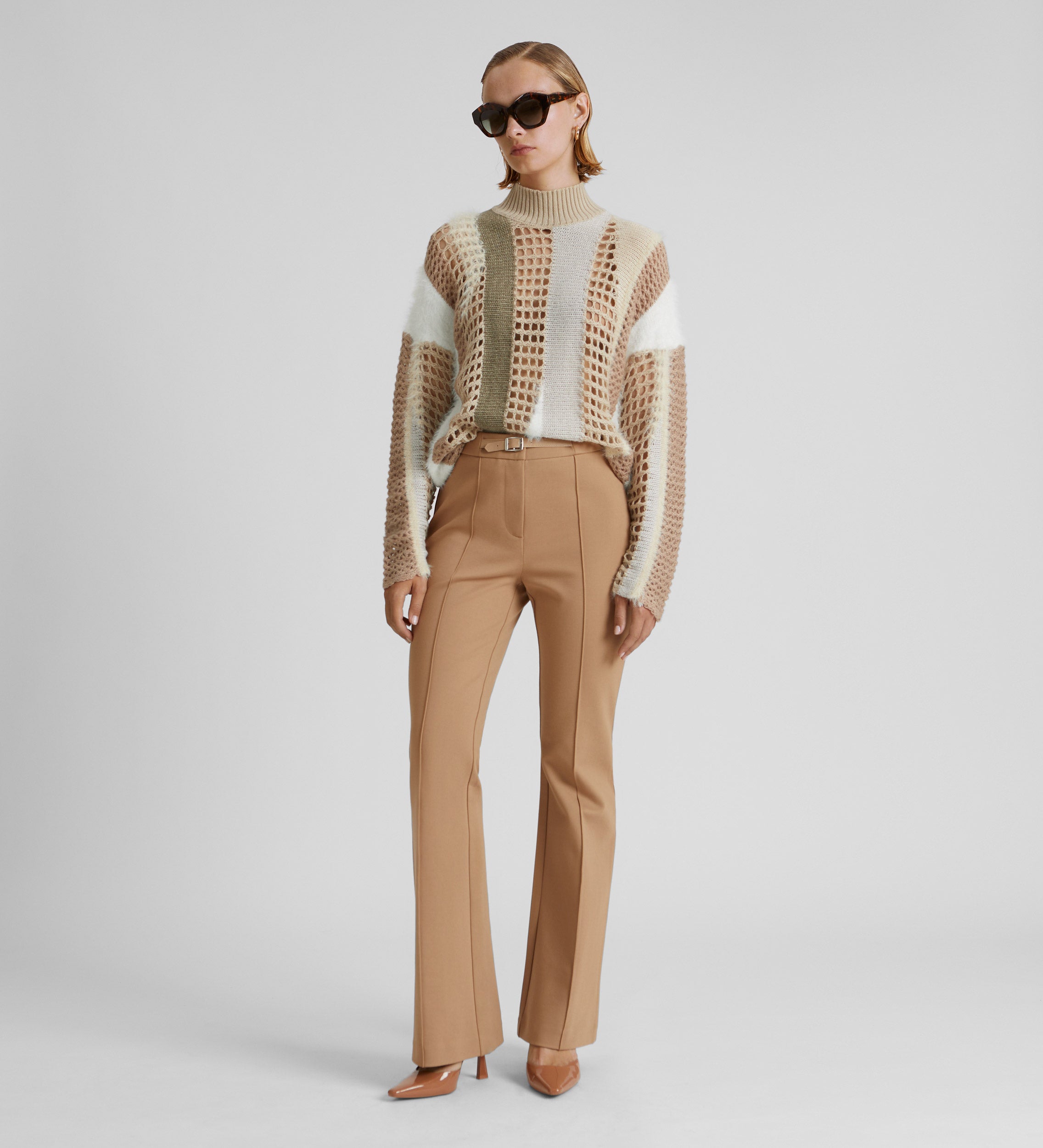 Elastic flared trousers with belt