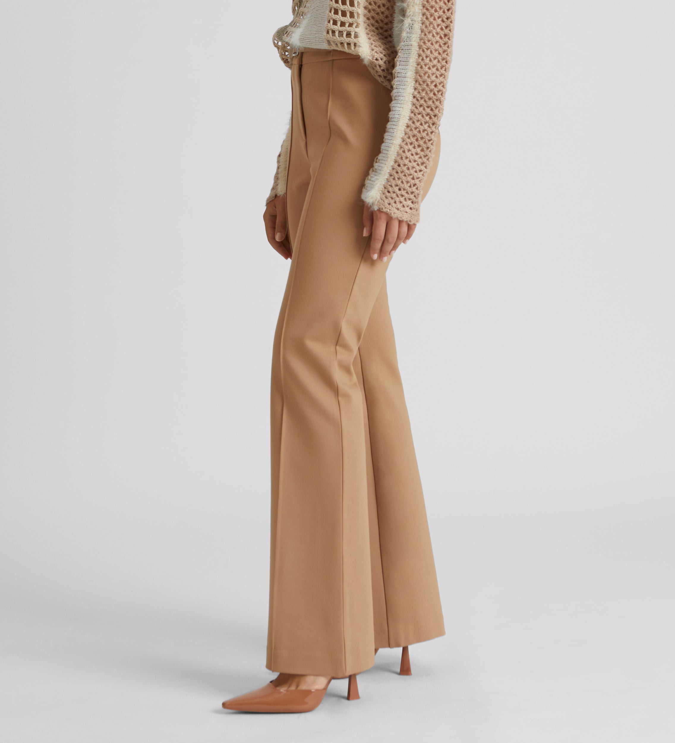 Elastic flared trousers with belt