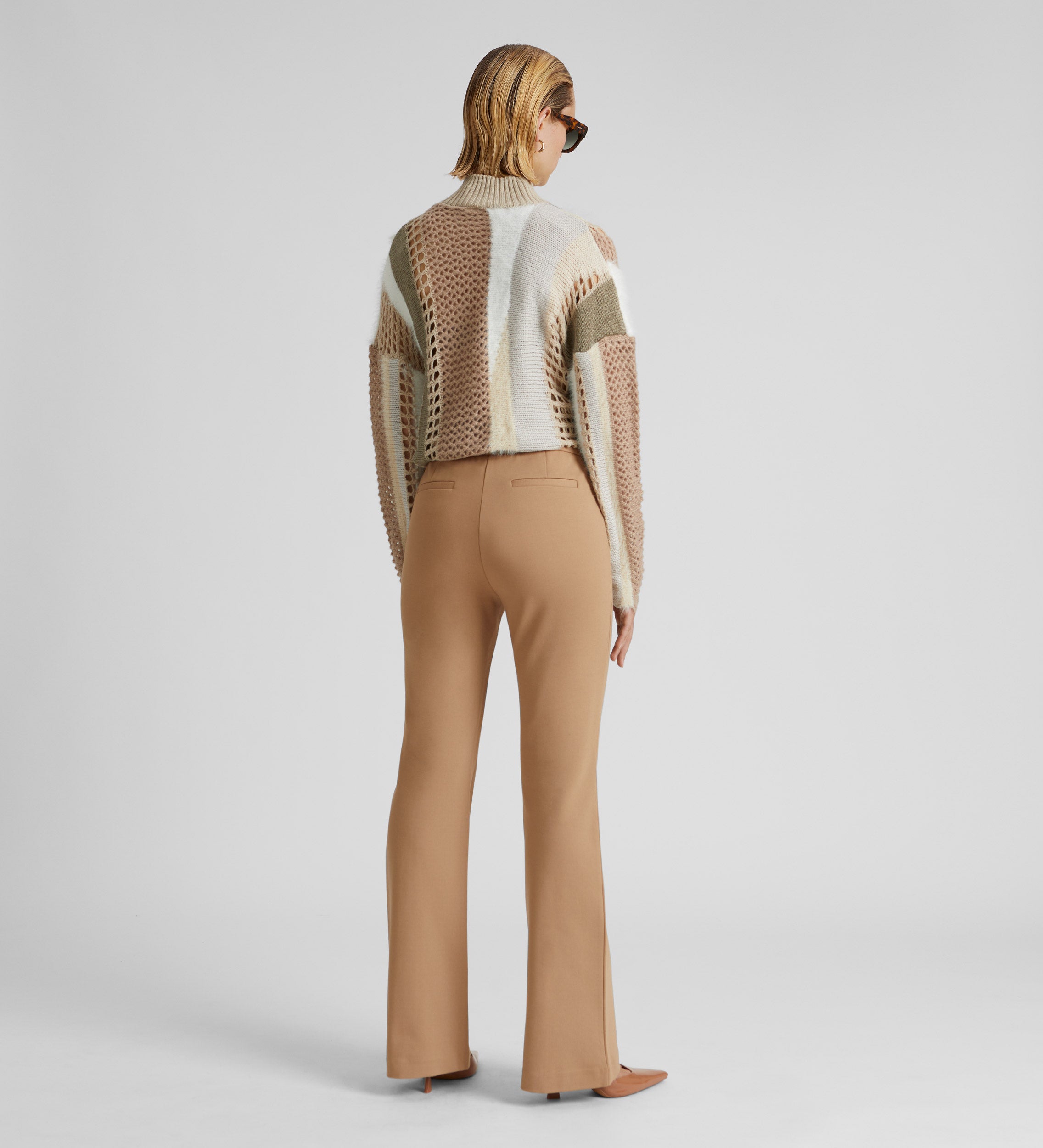 Elastic flared trousers with belt