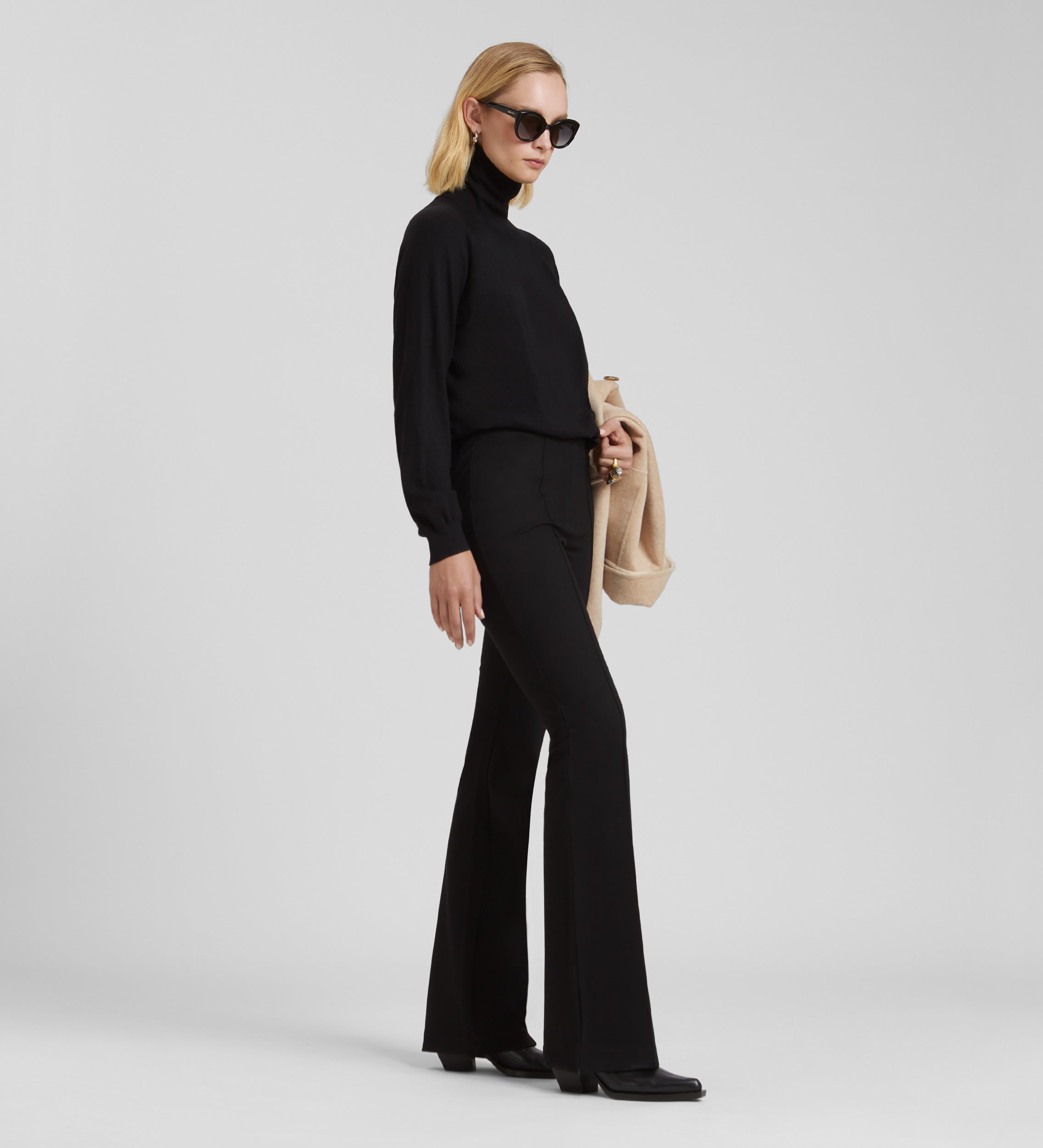 Elastic flared trousers with belt