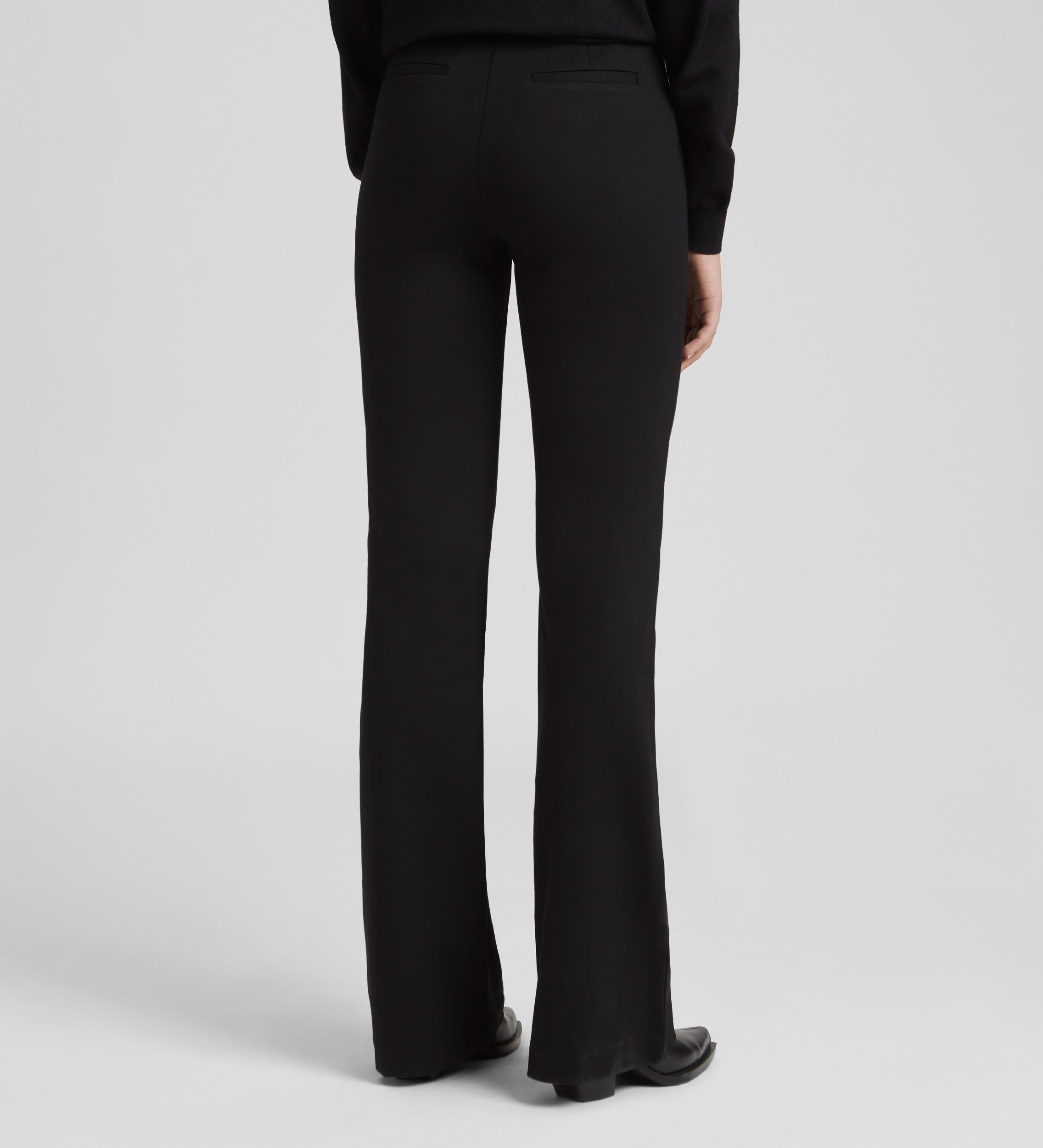 Elastic flared trousers with belt