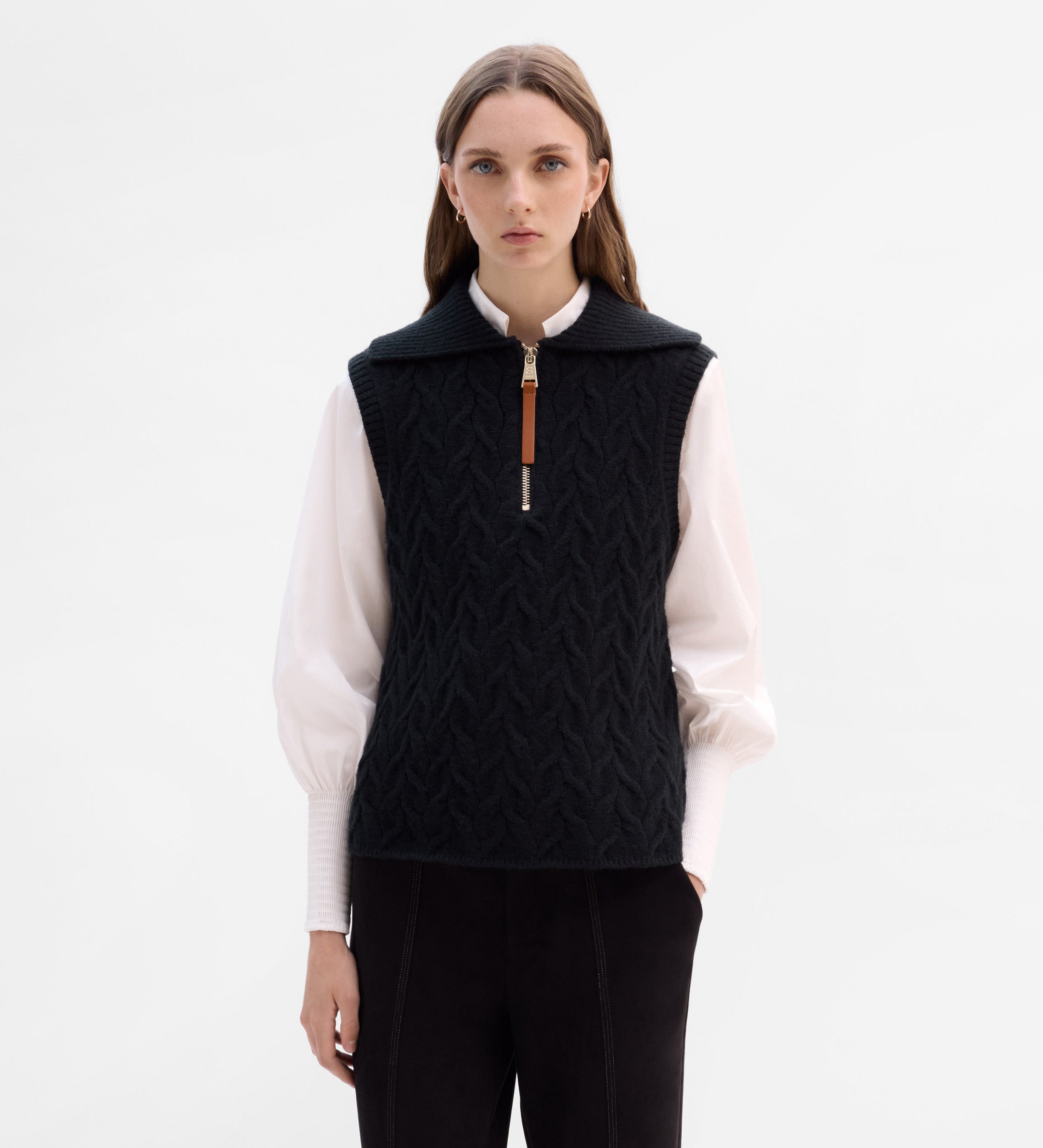 Knitted vest with braids