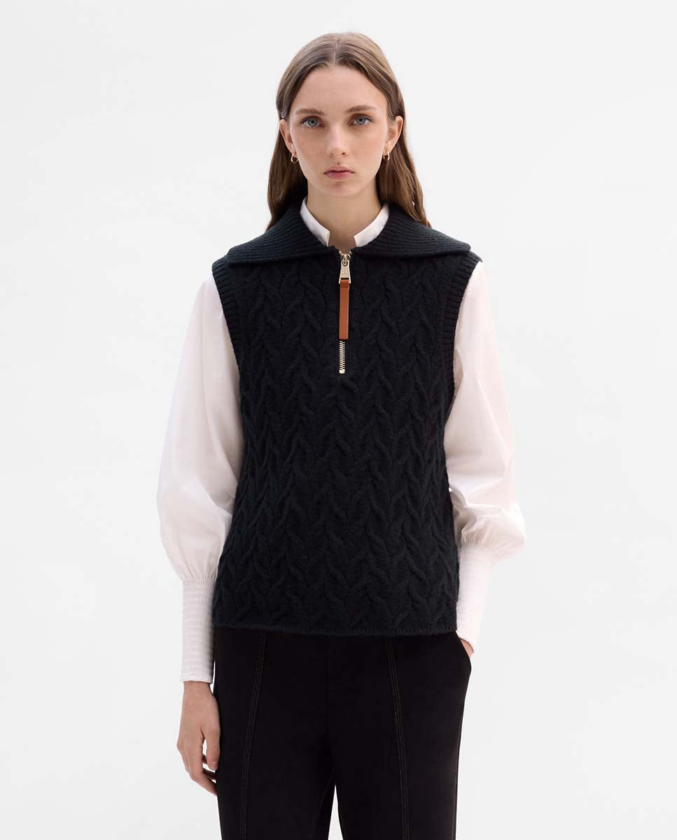 Knitted vest with braids