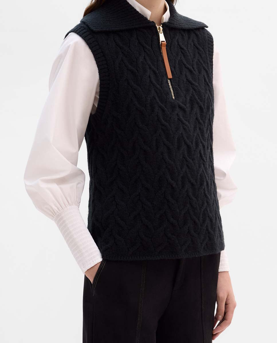 Knitted vest with braids