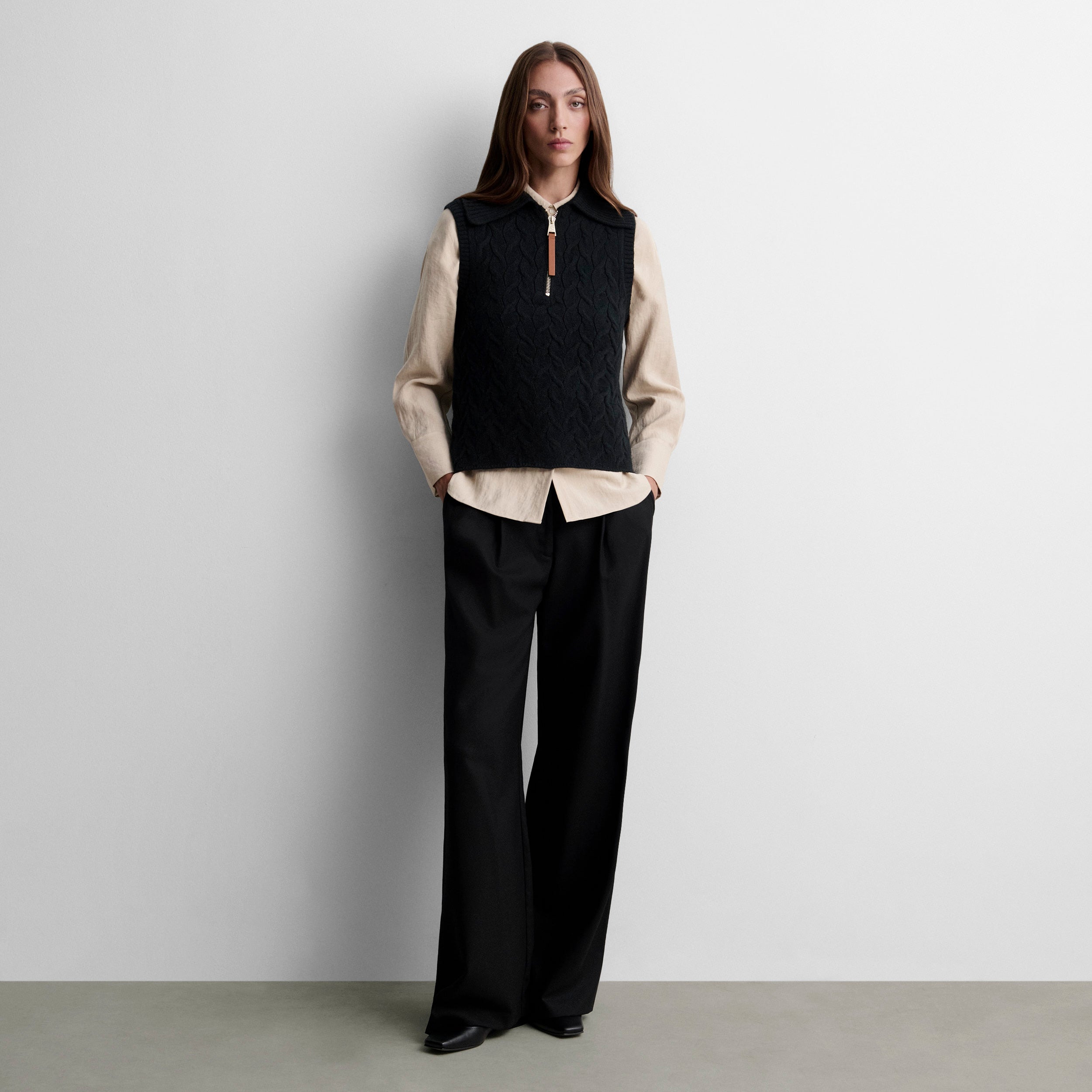 Gilet tricoté avec tresses