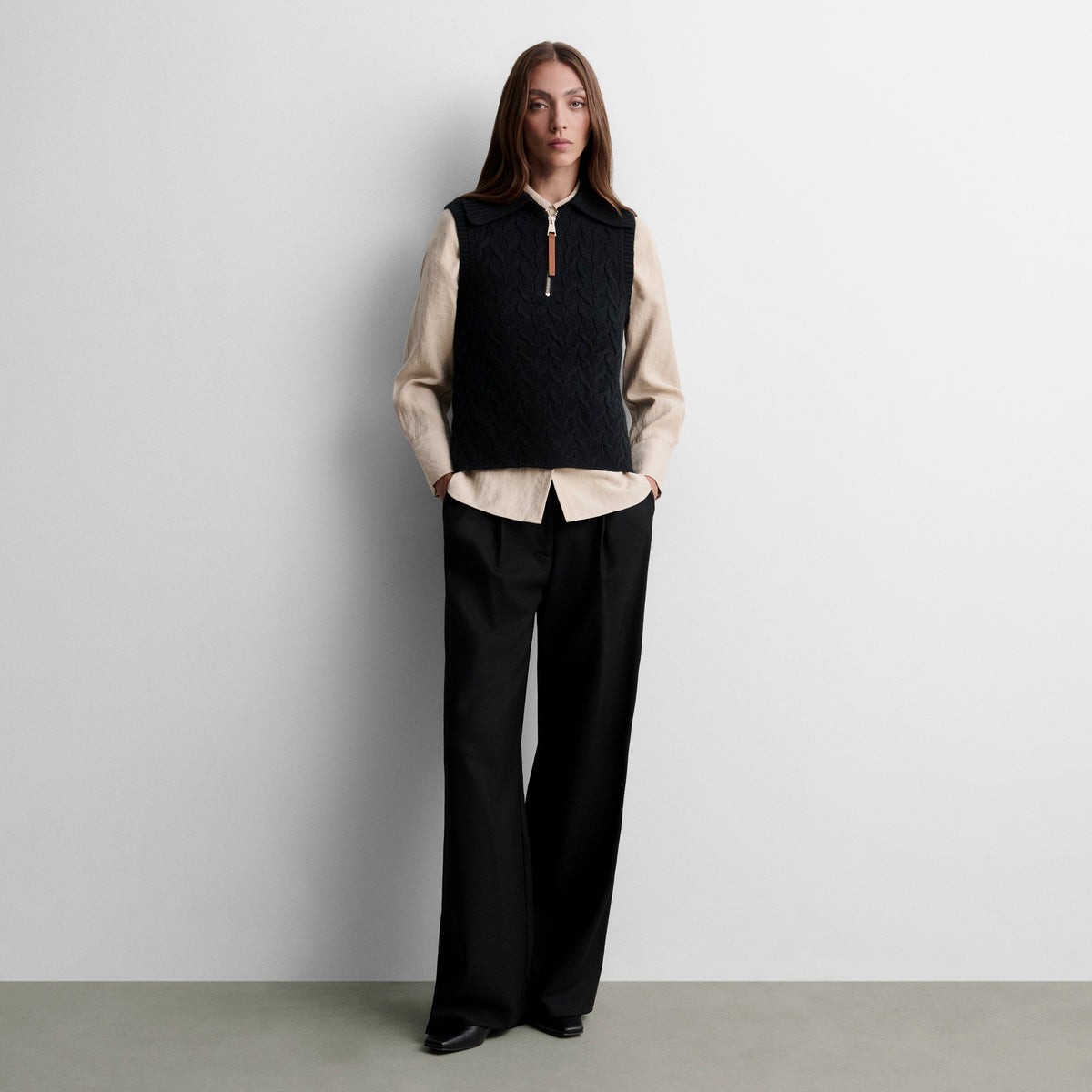 Gilet tricoté avec tresses