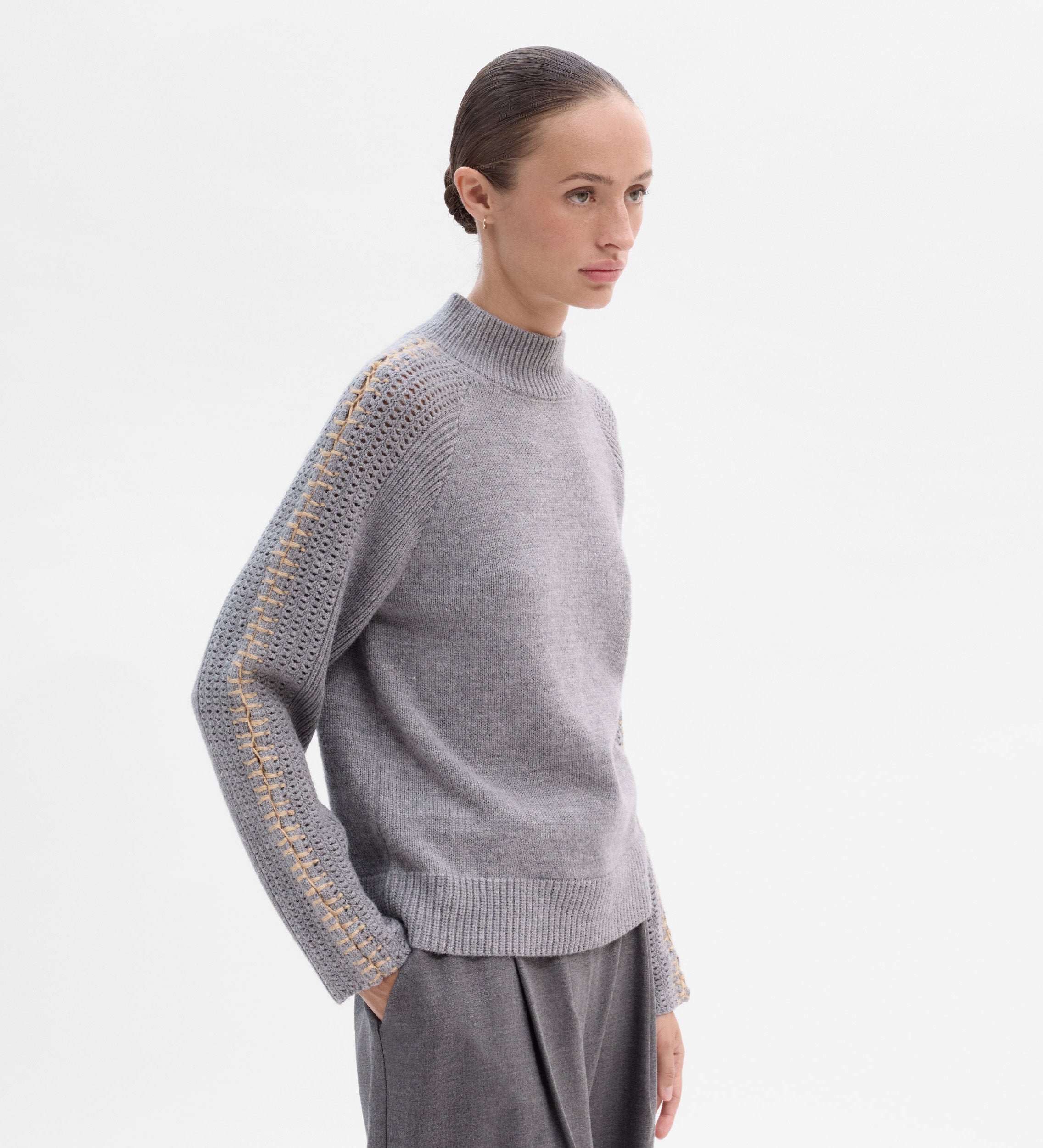Knit sweater with contrast stitching