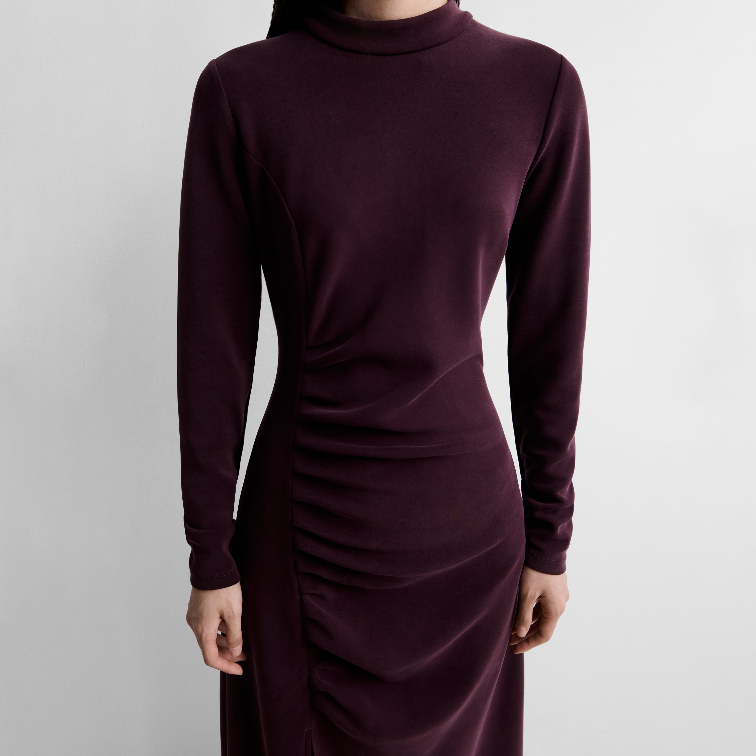 Dress with side draping