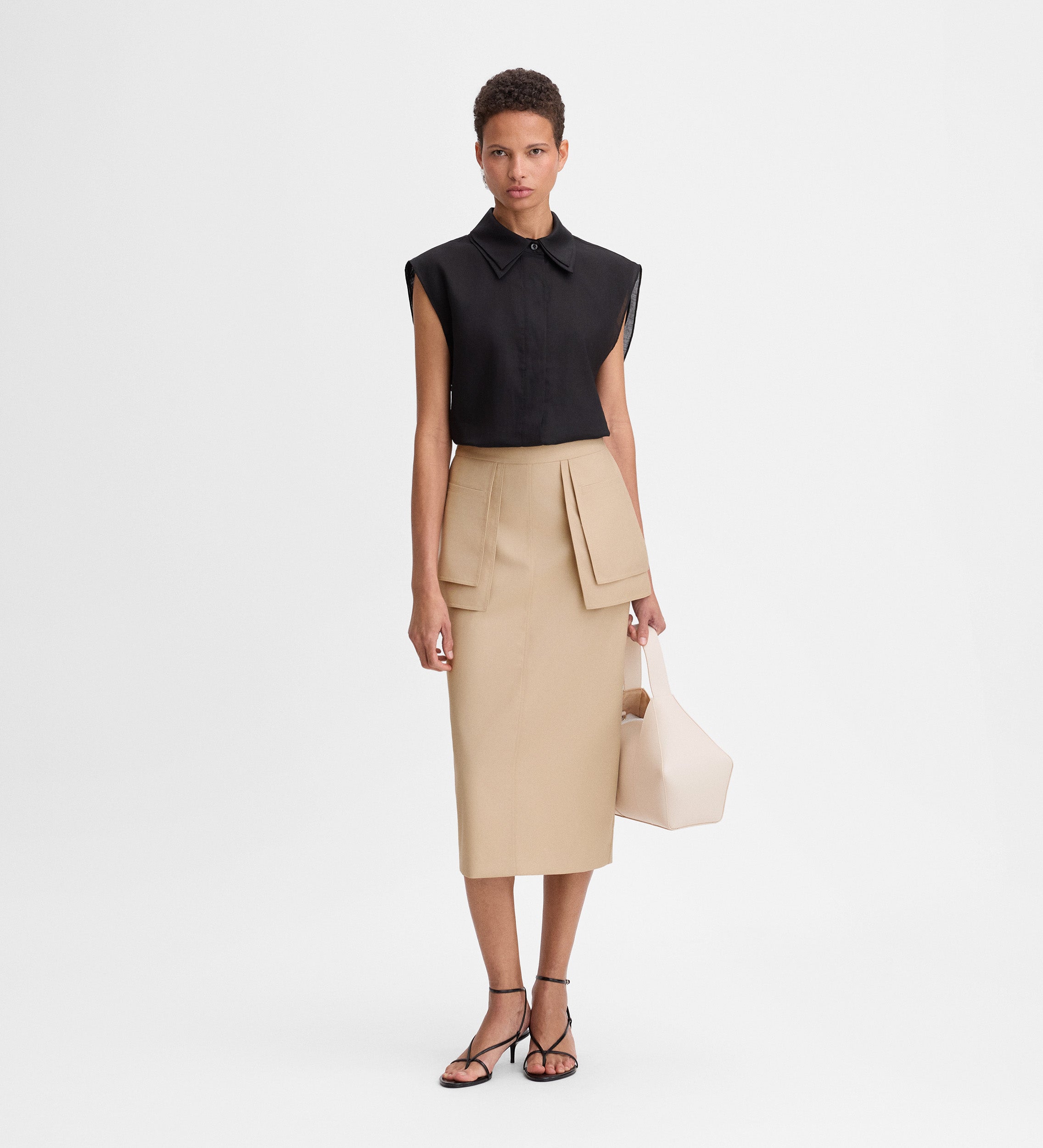 Falda midi detalle bolsillos