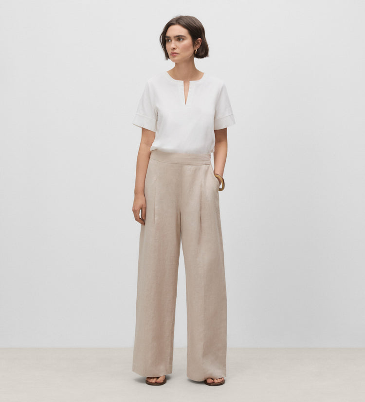 Trousers with stitched waistband