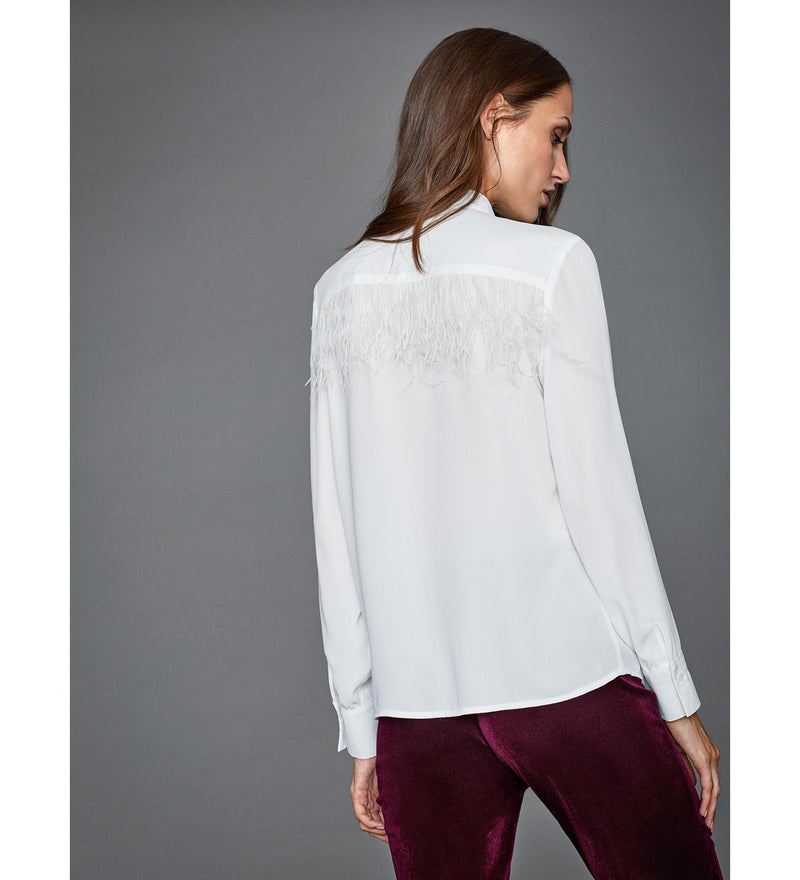 Blusa con plumas