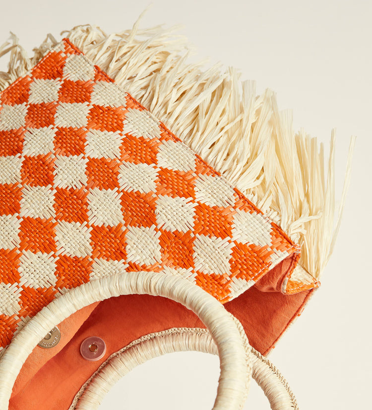 Fringed raffia bag